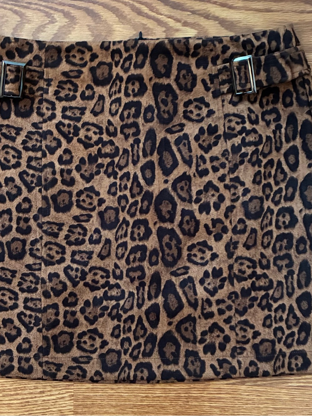 eesome Leopard-Print Mini Skirt in Brown and Black with Buckle Accents